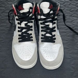 Red and grey jordan 1’s